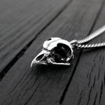 This Great Horned owl skull necklace, a mere 11/16" long is cast in solid 925 sterling silver. It is a perfectly proportional 3D miniature of a real great horned owl skull and retains all the unique details of the life size skull.