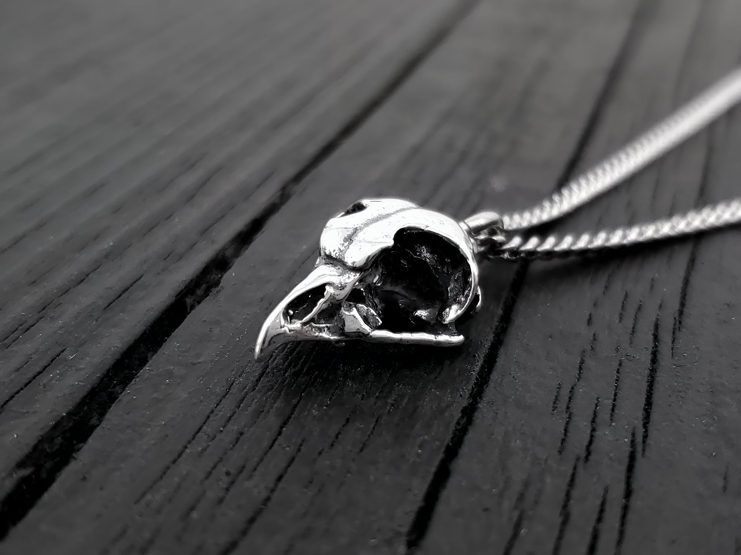 This Great Horned owl skull necklace, a mere 11/16" long is cast in solid 925 sterling silver. It is a perfectly proportional 3D miniature of a real great horned owl skull and retains all the unique details of the life size skull.