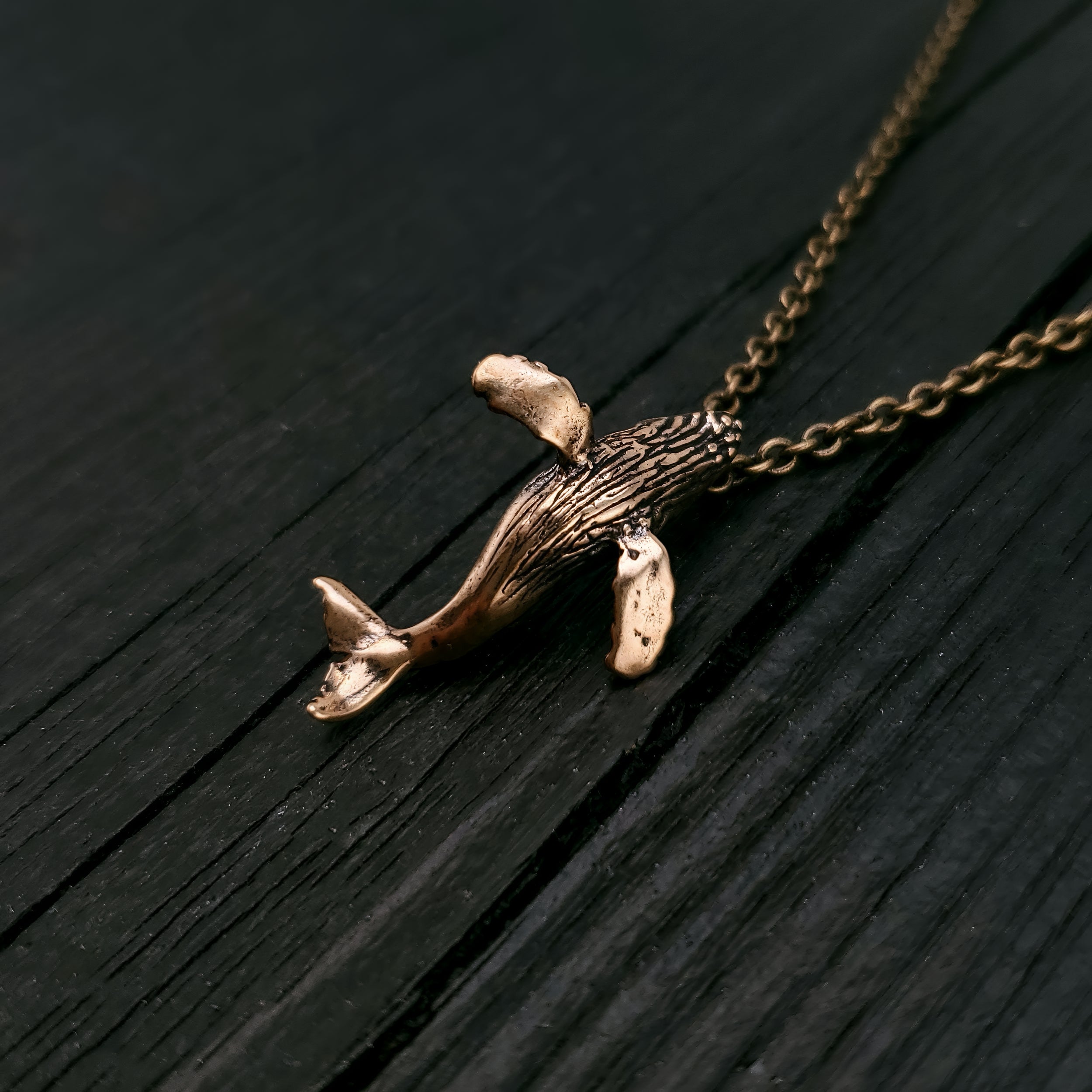 My breaching humpback whale is the perfect gift for anyone that appreciates these magnificent ocean mammals. This whale is completely three dimensional. It is cast in solid bronze with a generous integrated bail.