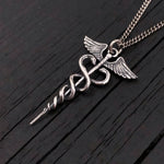 This beautifully detailed caduceus is cast in sterling silver, oxidized in recesses to enhance the fines detail of this 1.5" long pendant.