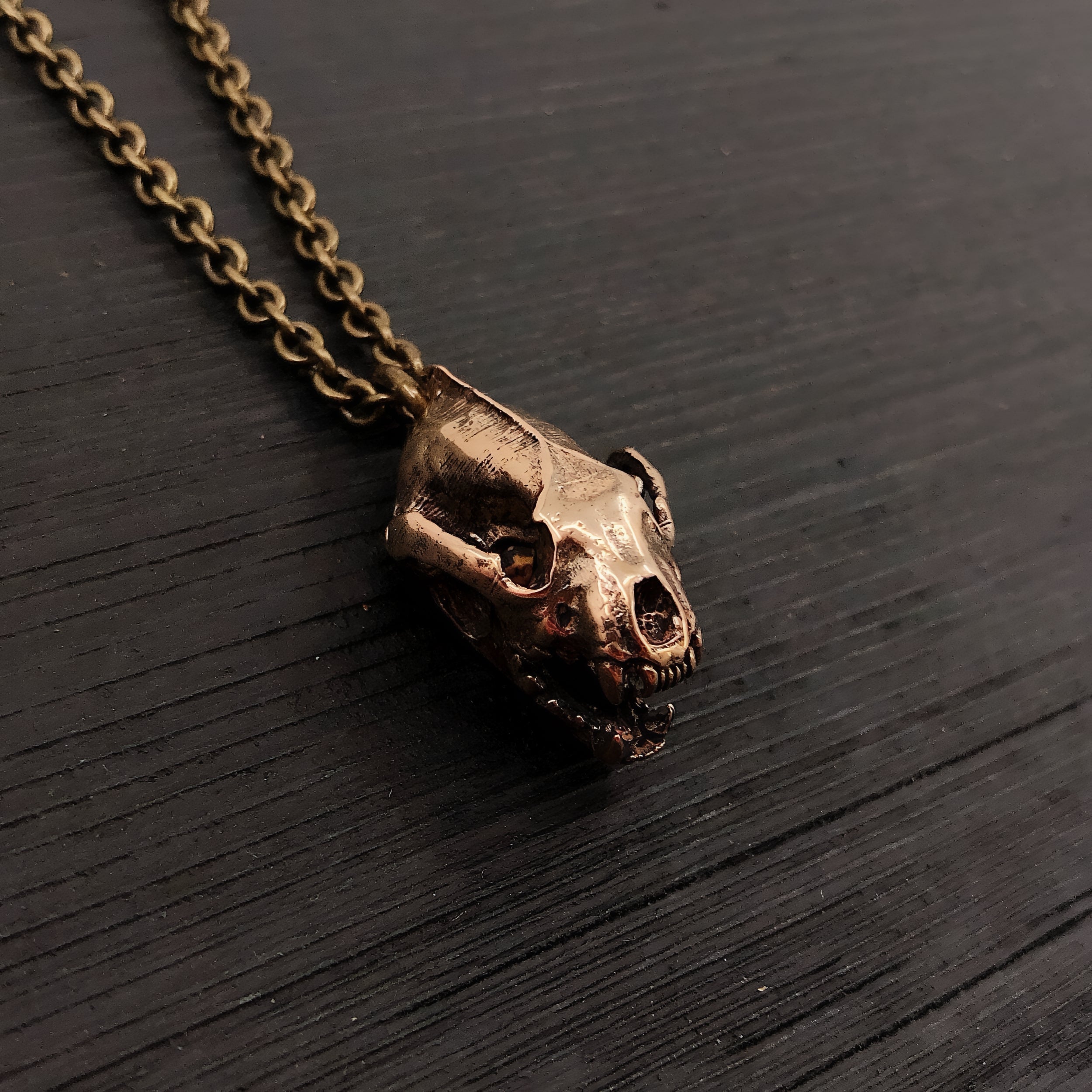 This 1" bronze wolverine skull pendant exhibits exceptional realistic detail with the jaw slightly ajar.