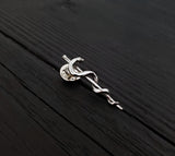 Silver snake pin on wooden table, intricate design | Moon Raven