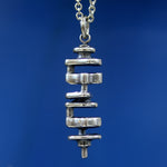 Silver necklace with fine chain on neutral backdrop