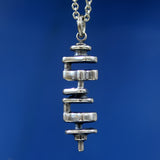 Silver necklace with fine chain on neutral backdrop