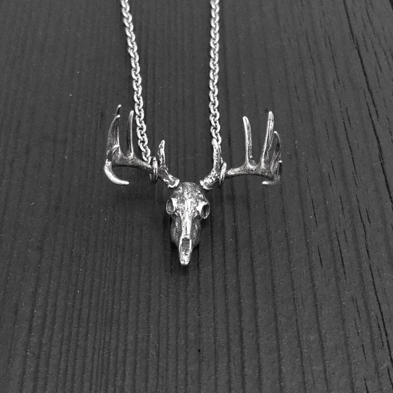 This pendant is the most realistic whitetail deer skull necklace you will find on Etsy. Made of sterling silver with an oxidized finish in the recesses. It measures 1-1/8&quot; wide and 1&quot; tall.